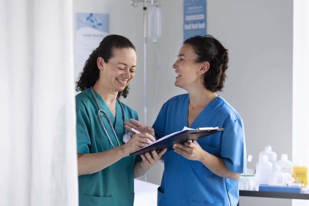Medical Staff Having A Conversation - Executive Leadership Support